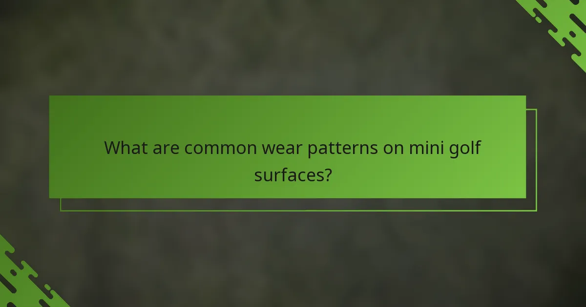 What are common wear patterns on mini golf surfaces?